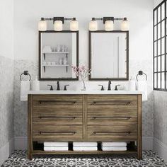 a bathroom with two sinks and mirrors on the wall next to a tiled floor in front of a window