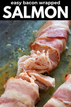 ham wrapped in bacon on a baking sheet with text overlay that reads easy bacon wrapped salmon