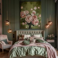 a bedroom decorated in green and pink with flowers on the wall above the bed, two chairs