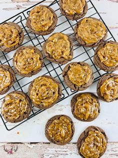 chocolate cookies with peanut butter frosting on a cooling rack