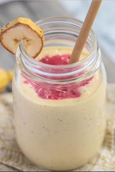 a jar filled with food and a wooden stick sticking out of it's side