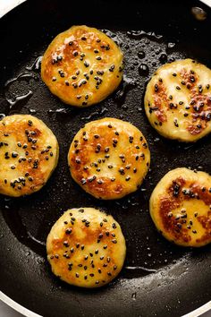 some food is cooking in a pan on the stove top and ready to be cooked