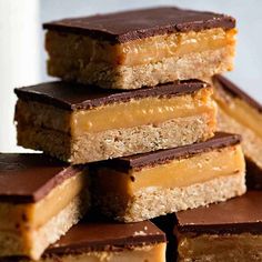 chocolate and peanut butter bars stacked on top of each other