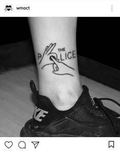 a black and white photo of a person's foot with a tattoo on it