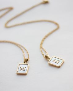 White 14k Gold Nameplate Jewelry, Luxury White Monogram Jewelry, Minimalist White Charm Necklace For Anniversary, Classic White Initials Necklace, Luxury White Initial Pendant Jewelry, Minimalist White Jewelry With Initial Pendant, White 14k Gold Filled Pendant Charm Necklaces, Minimalist White Personalized Jewelry, Classic White Jewelry With Initials