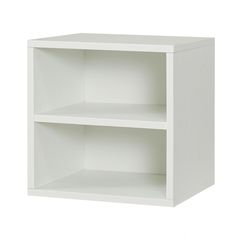 a white bookcase with two shelves on each side and one shelf above the other