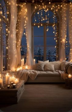 a living room filled with lots of candles and lights hanging from the ceiling next to a window