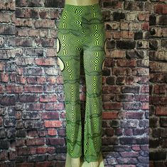 Trippy Neon Treats Cutout Bell Bottoms. It Features An Ultra Stretch Construction, Fit And Flare Design, High Waist, Thick Elastic Waistband, Side Cutout Accents, And Statement All Over Mind-Boggling Pattern. Please Note That One Side At The Top Of The Pants Has An Assymetrical Printed Pattern. Length Then Inseam Is Shown Brand New, Size Small, Great Stretch, True To Size. Mannequin Bust 34", Waist 26" And Hips 38" Y2k Style Stretch Party Bottoms, Rave Style Bottoms For Spring Night Out, Spring Rave Bottoms For Night Out, Rave Bottoms For Spring Night Out, Fitted Green Bottoms For Rave, Spring Rave Club Bottoms, Spring Club Rave Bottoms, Spring Rave Bottoms For Club, Rave Bottoms For Club In Spring