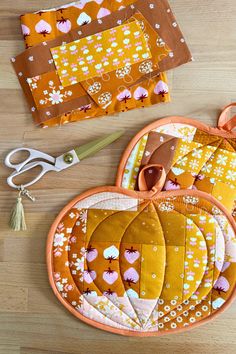 sewing supplies laid out on top of a wooden table