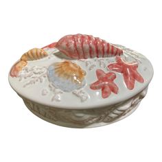 a bowl with shells and starfish on it