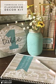 a table topped with mason jars filled with flowers and other items on top of it