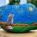 this is an image of a hand painted rock