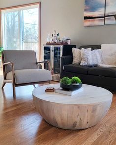 a living room with two couches and a coffee table in the middle of it