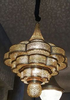 an ornate chandelier hangs from the ceiling