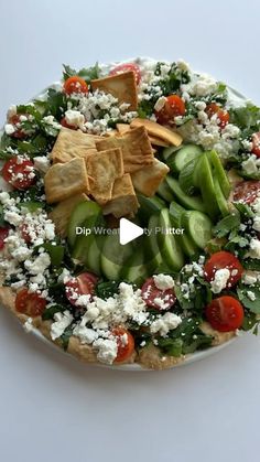 a white plate topped with salad and chips