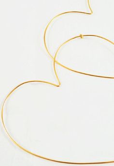 "Love 'to infinity' when wearing your Endless Love heart shaped hoop earrings. These carefully handmade gold filled or sterling silver wire earrings will help you express your unique spirit while sharing love with everyone you meet! Handmade Available in gold filled, silver filled or rose gold wire Available in \"Small\" (Day Wear) and \"Large\" sizes Small size: 2\"H x 2\"W Large size: 3\"H x 3\"W Standard shipping: 3-5 business days; contact us for faster shipping options. Brave Chick's missio Shaped Hoop Earrings, Silver Wire Earrings, Endless Love, Handmade Gold, Gold Wire, Wire Earrings, Silver Wire, Or Rose, San Jose