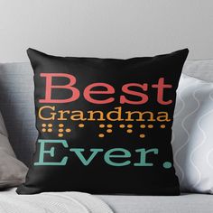 the best grandma ever throw pillow is shown on a couch with pillows in front of it