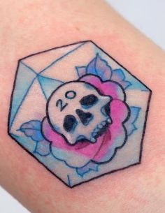 a skull and rose tattoo on the left arm with an envelope in the background that says 90