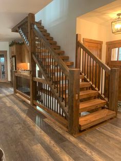 a wooden staircase in a home with hardwood floors