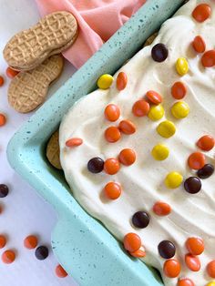 an ice cream sundae with jelly beans and cookies on the side is ready to be eaten