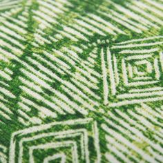 an abstract green and white pattern on fabric