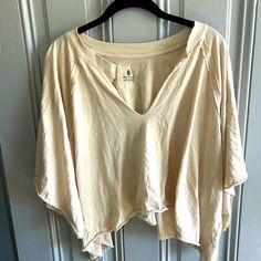 Free People Movement Top, Beige, Size Large. Hole On Back From Tag Being Pulled. Never Worn, Just Washed Beige V-neck Summer Top, Neutral V-neck Beach Top, Casual Neutral Tops For Beach, Summer Beige V-neck Top, Beige Summer Tops For Beach, Cream V-neck Top For Beach, Neutral Cotton Beach Blouse, Beach Cotton Blouse In Neutral Color, Cotton Beach Blouse In Neutral Color