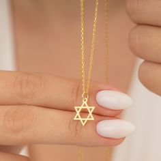 "★ WELCOME TO SWANJEWELRYUS ★ 925 Sterling Silver and 14K Solid Gold Minimalist Star Of David Necklace, 14K Gold Plated Magen David Necklace for Christmas Gift ★ SwanJewelryUS Best Quality Jewelry are perfect gift for your loved ones or just for yourself! ★ Item Details ★ ★Handmade item Materials: 925K Sterling Silver and 14K Solid Gold ★ Finish: Silver, Gold, 14K Solid Gold and Solid White Gold ★ Chain style: Cable ★ Adjustable length ★ Style: Minimalist ★ Ecological product ★ Height X Width: 17,5mm X 17,5mm   ★ Chain Lengths: \"12 inch - 30 cm, \"14 inch - 35 cm, \"16 inch - 40 cm, \"18 inch - 45 cm, \"20 inch - 50 cm, \"22 inches - 55 cm ★ Wear it daily or for a night out, either way your SwanJewelryUS will complete your style. ★ How To Order ★ *Select options from the dropdown menu. *A Star Of David Charm Jewelry Gift, Christmas Star Charm Jewelry Gift, Spiritual Star Of David Charm Necklace Gift, Star Of David Necklace For Gift, Star Of David Necklace For Hanukkah Gift, Hanukkah Gift Necklace With Star Of David, Spiritual Jewelry For Hanukkah Gift, Magen David Necklace, Jewish Star Necklace