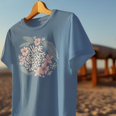 Embrace the Tropical Vibes with Our Ocean Blue Wave Washed Tee!This shirt is garment dyed and wave washed to give it that perfect beachy vibe. The ocean blue backdrop perfectly complements the hand drawn design by one of our artists from Maui, making it a wearable piece of art that's both stylish and comfortable. Unisex Soft Wash Garment Dyed TeeSuper soft garment-dyed t-shirt made 100% with ring-spun cotton. The soft-washed, garment-dyed fabric brings extra coziness to your wardrobe while the r Surfrider Foundation, Blue Backdrop, Blue Backdrops, Tropical Blue, Wave Design, Blue Waves, Tropical Vibes, Hand Drawn Design, Dyed Fabric