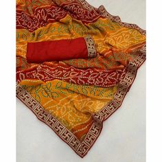 Red & Yellow color saree is made from georgette is highlighted with beautiful foil printed with printed with embroidered border work as shown. Comes along unstitched embroidered banglori silk blouse piece which you can customise as per your design/style. Occasion - You can wear this saree for festive and functions. Note:- The actual product may differ slightly in color and design from the one illustrated in the images when compared with computer or mobile screen. Measurements: Saree : Georgette