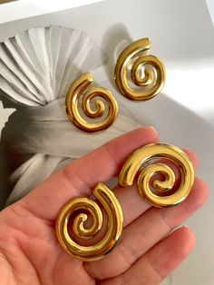 Embrace your inner beauty with our Spiral Statement Earrings. Made with stainless steel and gold plating, these earrings are sure to make a statement and elevate any outfit. Step out in style and let your elegance shine. Carrie Necklace, Trending Earrings, Gold Minimalist Jewelry, Jewelry Aesthetic, Find Your Way, Earring Trends, Casual Jewelry, Jewelry Accessories Ideas, Spiral Earrings