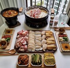 an assortment of food is displayed on a table