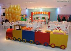 a train themed birthday party with balloons and food