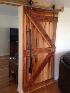 an open wooden door in a living room