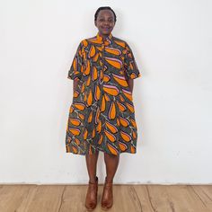 With the lily dress you are sure to stand out! Our loose fit colourful dresses made out of non-stretchy African print are perfect for you in case you are looking for a style idea that is versatile, comfortable, and looks fabulous year-round. All materials used to design the dresses are sourced in Kenya.  MEASUREMENT GUIDE:  We recommend asking questions about sizes or you can take your own measurements (at the bust) if unsafe. Since its an A- Line, you only need to ensure that you have the right Orange Printed Short Sleeve Midi Dress, Orange Printed Midi Dress With Short Sleeves, Casual Multicolor Midi Dress With Pockets, Multicolor Midi-length Dress With Pockets, Multicolor Midi Length Dresses With Pockets, Multicolor Midi Dress With Pockets, Casual Short Sleeve Midi Dress With Vibrant Print, Orange Short Sleeve Dress With Pockets, Woman Summer Dress