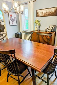 Dining Room with Sapele Wood table, black painted wood chairs, hardwood floors and dining room lighting. Sapele Wood, Wood Dining Room Table, Custom Sinks, Custom Dining Tables, Wood Dining Room