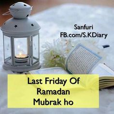 the last friday of ramadan mubarak ho with an open book and lit candle