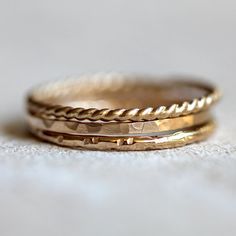 Gold stacking rings by PraxisJewelry 14k Gold Filled Fine Jewelry Stackable Rings, Gold 14k Stackable Rings, 14k Gold Hammered Stackable Promise Rings, Dainty Stackable Rings In Recycled Gold Stamped 14k, Stacked 14k Yellow Gold Rings, Stackable Rings In Recycled Gold Stamped 14k, Yellow Gold Stacking Rings, Gold Stacking Rings, Gold Wedding Bands