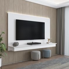 a flat screen tv mounted on the wall in a living room