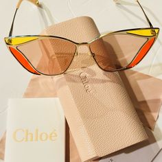 Elevate Your Style With These Chic Chloe Sunglasses. The Gold Cat Eye Frame Adds A Touch Of Glamour While The Dark Brown Lenses Provide Full Uv Protection. These Sunglasses Are Perfect For Any Occasion And Will Complement Any Outfit. Crafted With High Quality Materials, These Sunglasses Are Durable And Long-Lasting. The Brand Name Chloe Adds A Touch Of Luxury To The Design. These Unisex Sunglasses Are Suitable For Anyone Who Wants To Add A Touch Of Elegance To Their Look Luxury Orange Sunglasses, Elegant Yellow Sunglasses For Party, Elegant Yellow Party Sunglasses, Chic Orange Cat Eye Sunglasses With Gradient Lenses, Elegant Multicolor Sunglasses For Summer, Chic Orange Sunglasses For Party, Elegant Orange Sunglasses With Uv Protection, Chic Orange Cat Eye Sunglasses, Designer Cat Eye Sunglasses For Summer