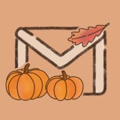 an envelope with three pumpkins in front of it