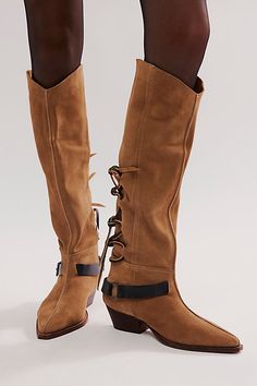 It’s all in the details with this slouchy, Western-inspired boot, featured in a soft suede fabrication and pull-on design with lace-up detailing and spur strap accent. **Features:** Tall style, slouchy design, suede uppers, pull-on, pointed toe, lace-up back detailing, spur strap with buckle accent, block heel **Why We | Back-lace Sway Low Slouchy Boots by FP Collection at Free People in Green, Size: US 8 Laced Suede Boots For Fall, Fall Lace-up Suede Mid-calf Boots, Fall Suede Lace-up Boots With Suede Lining, Slouchy Suede Boots, Spur Straps, Slouchy Boots, Boho Clothing, Soft Suede, Suede Boots