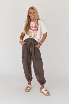 A true comfy boho classic is the True To You Jogger Pant - they're a showstopper! Get ready for the ultimate comfort and so many compliments while wearing these because they feature: So cozy, mineral - washed fabric Loose and slouchy jogger pant silhouette High - rise elastic drawstring waistband Exposed seams throughout for added boho style Convenient side pockets and patch pockets along the legs and backside Cute gathered elastic ankle closures Your new favorite comfy boho outfit pair with: He Washed Black Loungewear Pants With Pockets, Washed Black Pants With Elastic Waistband For Loungewear, Washed Black Elastic Waistband Pants For Loungewear, Relaxed Fit Harem Pants For Fall Loungewear, Linen Cargo Bottoms For Loungewear, Washed Black Relaxed Fit Pants With Elastic Waistband, Washed Bottoms For Loungewear In Fall, Fall Washed Bottoms For Loungewear, Relaxed Cotton Cargo Pants For Loungewear