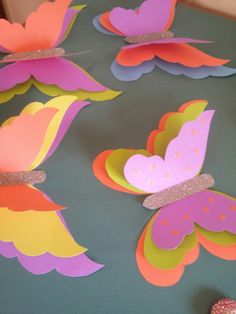 some paper butterflies are on a table