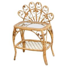 a small table with a glass top and wicker design on the bottom, against a white background