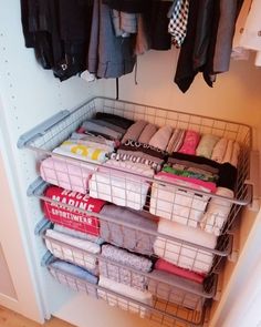 the closet is filled with clothes and other items