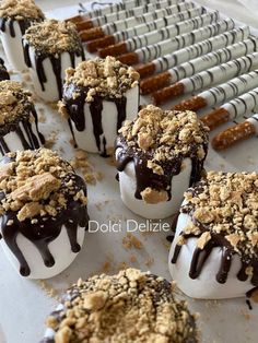 chocolate covered desserts are sitting on a tray