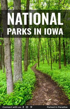 the national parks in iowa sign over a dirt path surrounded by green grass and trees