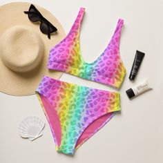 This 90s neon animal print inspired rainbow cheetah print bikini is perfect for the beach, a pride festival, 90s, Y2K, or bachelorette party. This high-waisted swimsuit features a flattering fit, and the bright colors will make you stand out from the rest. Combine two trends in one (while supporting a recycled product)! * 88% Recycled Plastic *Produced sustainably * Double-layered and non-reversible * Removable padding * Tear-away care label * LGBTQ+ woman owned shop Rave Multicolor Swimwear For Vacation, Multicolor Rave Swimwear For Vacation, Rave Style Multicolor Swimwear For Vacation, Multicolor Swimwear For Beach And Pride, Rave Multicolor Swimwear For Beach Season, Fitted Swimwear For Pride Beach Events, Fitted Swimwear For Beach And Pride Festival, Fitted Swimwear For Beach At Pride Festival, Rave Multicolor Swimwear For Swimming