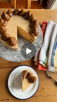 a piece of cheesecake on a plate next to a slice of cake with chocolate icing