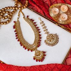 Perfect choice for the wedding events, our Sabira Mala is impeccably designed with enticing details! Exuding brilliance, this mala is encrusted with glittering kundan stones and ruby bead drops. Approximate mala length is 10". Gold-plated on high-quality brass as base metal. Made by order. Kindly allow 5-7 weeks for the delivery of this item. For custom or urgent requests, please contact support@alacouture.com. *Please Note: We use faux stones and beads in all of our jewelry. Ruby Beads, Waist Chain, Faux Stone, Head Accessories, Gift Card Shop, Base Metal, Ring Gift, Wedding Events, Anklets